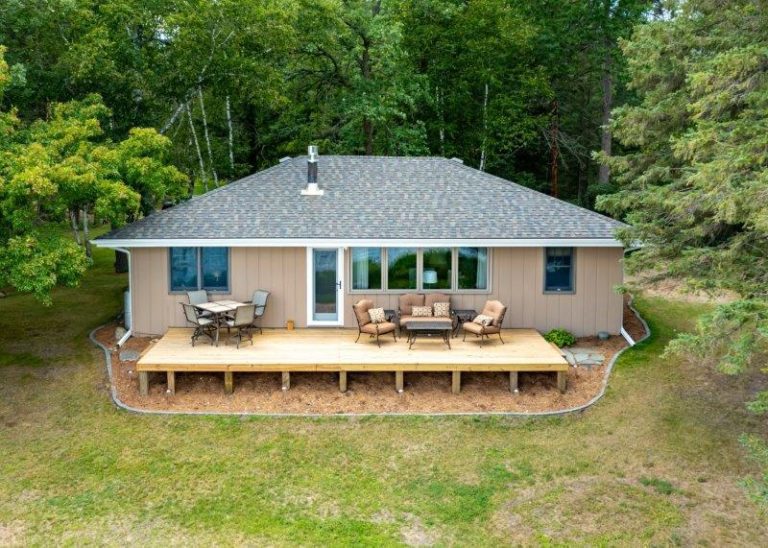 Cabin front with new deck and seating to enjoy the view